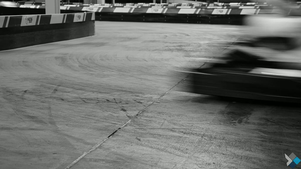 Black and white motion blur of a kart on an early ProKarting track