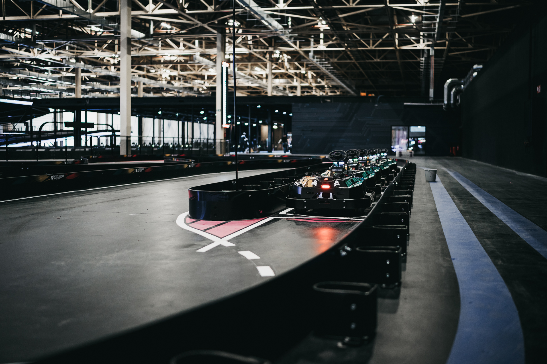 Mini karting track in low lighting at Experience Factory Antwerp